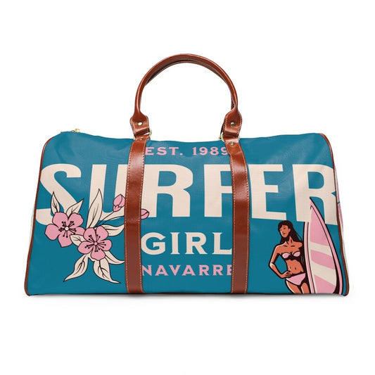 Teal and Pink Personalized Overnight Weekender Tote Bag Luggage. This bag has leather brown handles and straps, the bottom is brown leather. It has Teal, Cream and Pink tones. It has sufer girl on one side with flowers and a girl with a pink surfboard.